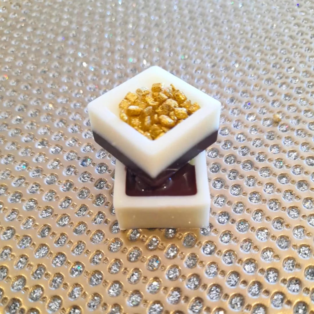 Stacked square celebration/wedding chocolates with gold nuggets in the centre